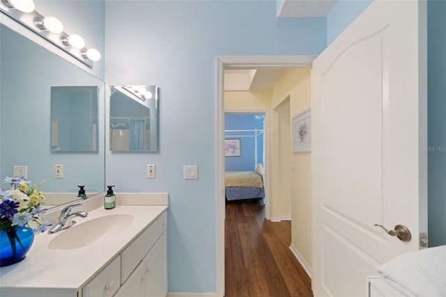33 Veranda Way Unit 33, Palm Coast, FL 32137 - full bathroom featuring vanity, wood finished floors, baseboards, and ensuite bath