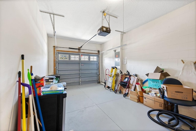33 Veranda Way Unit 33, Palm Coast, FL 32137 - garage with electric panel, a garage door opener, and concrete block wall