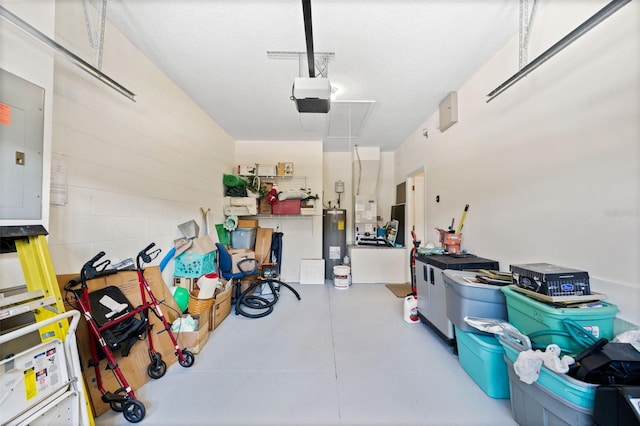 33 Veranda Way Unit 33, Palm Coast, FL 32137 - garage with electric water heater, a garage door opener, and electric panel