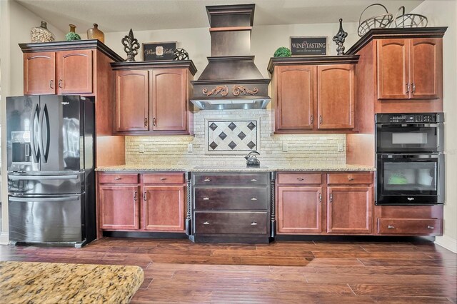 568 Luna Bella Ln, New Smyrna Beach, FL 32168 - kitchen featuring stainless steel fridge with ice dispenser, premium range hood, light stone counters, dark wood-style flooring, and tasteful backsplash