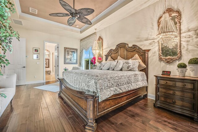 568 Luna Bella Ln, New Smyrna Beach, FL 32168 - bedroom with a raised ceiling, wood-type flooring, baseboards, ornamental molding, and a ceiling fan