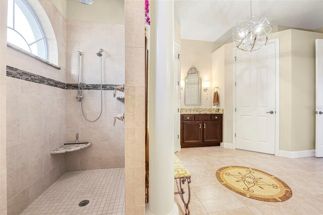 568 Luna Bella Ln, New Smyrna Beach, FL 32168 - full bathroom featuring a walk in shower, vanity, tile patterned floors, and a chandelier