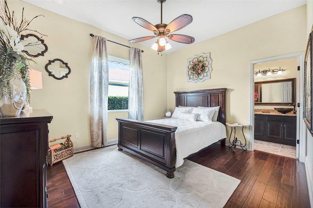 568 Luna Bella Ln, New Smyrna Beach, FL 32168 - bedroom featuring dark wood-style floors, ensuite bath, a sink, and ceiling fan