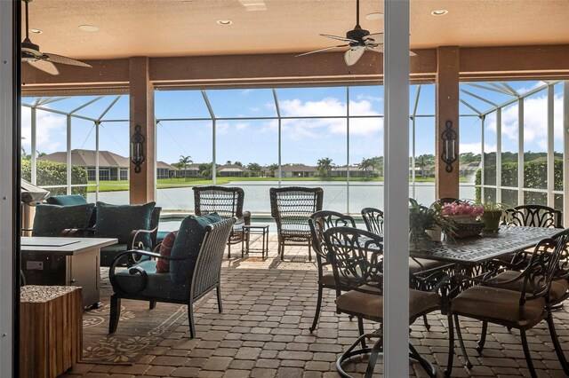 568 Luna Bella Ln, New Smyrna Beach, FL 32168 - view of patio with a ceiling fan, a lanai, and a water view