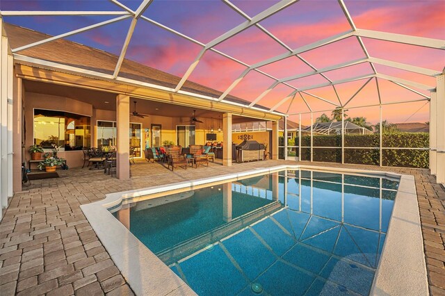 568 Luna Bella Ln, New Smyrna Beach, FL 32168 - view of swimming pool featuring a patio, ceiling fan, and a lanai