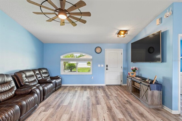 226 Pinegrove Dr, Palm Coast, FL 32164 - living room with a ceiling fan, wood finished floors, and baseboards