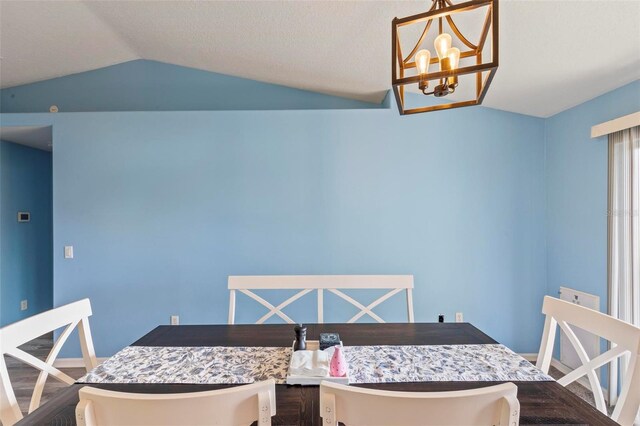 226 Pinegrove Dr, Palm Coast, FL 32164 - dining area featuring lofted ceiling and a chandelier