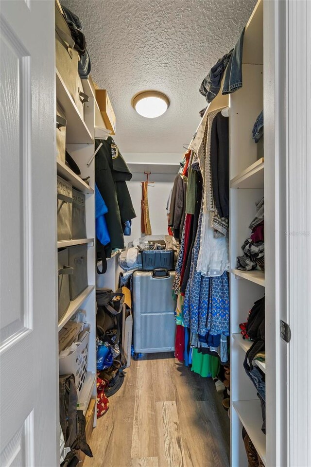 226 Pinegrove Dr, Palm Coast, FL 32164 - spacious closet featuring wood finished floors