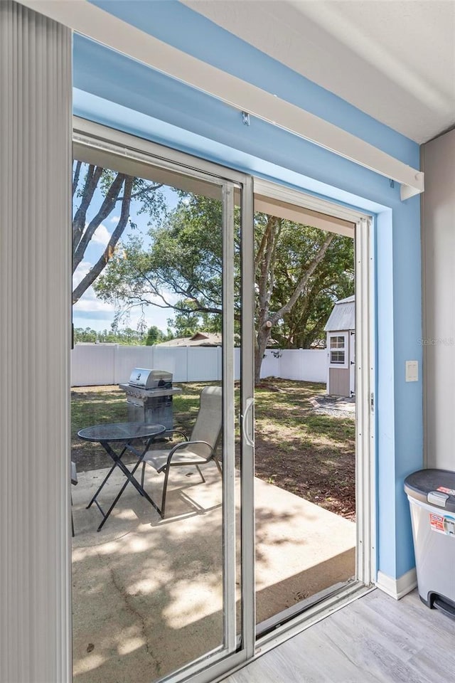 226 Pinegrove Dr, Palm Coast, FL 32164 - doorway featuring wood finished floors