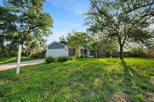 1317 Northside Dr, Ormond Beach, FL 32174 - view of front of property with driveway and a garage