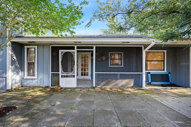 1317 Northside Dr, Ormond Beach, FL 32174 - view of front of home featuring board and batten siding and a patio