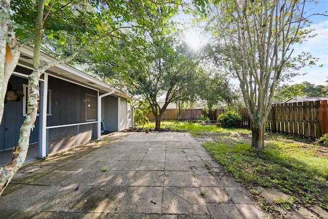 1317 Northside Dr, Ormond Beach, FL 32174 - fenced backyard with a patio area