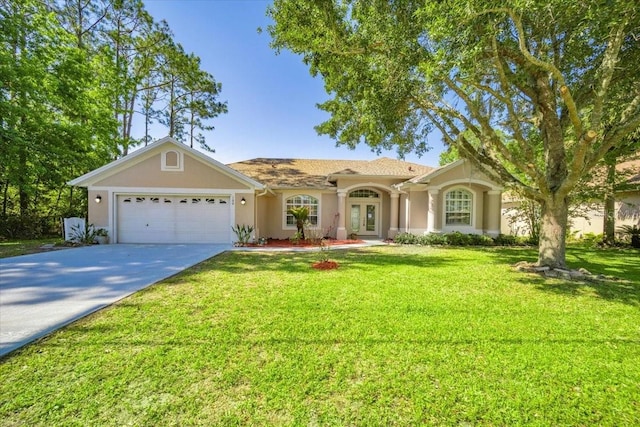 100 Point Pleasant Dr, Palm Coast, FL 32164 - view of front of house featuring stucco siding, an attached garage, french doors, driveway, and a front yard