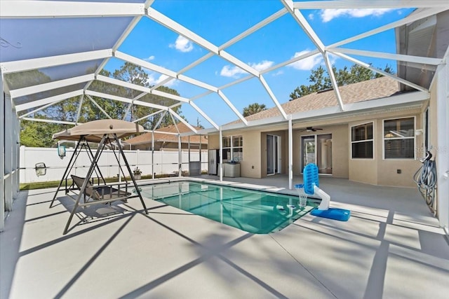 100 Point Pleasant Dr, Palm Coast, FL 32164 - view of pool featuring a patio, ceiling fan, and glass enclosure
