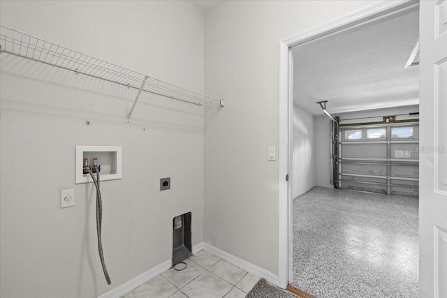 100 Point Pleasant Dr, Palm Coast, FL 32164 - laundry area with hookup for a washing machine, electric dryer hookup, and baseboards
