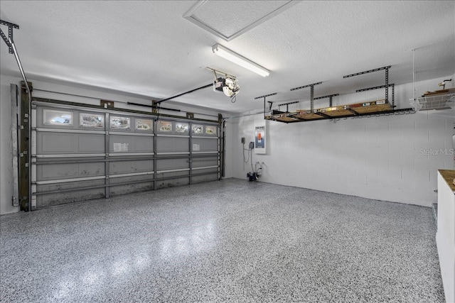 100 Point Pleasant Dr, Palm Coast, FL 32164 - garage with a garage door opener, electric panel, and concrete block wall