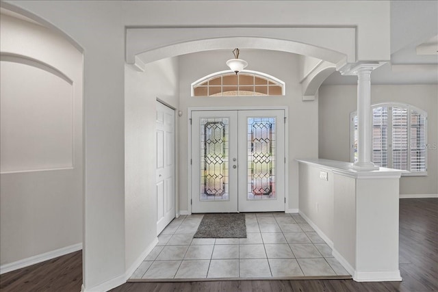 100 Point Pleasant Dr, Palm Coast, FL 32164 - entryway with french doors, ornate columns, and baseboards