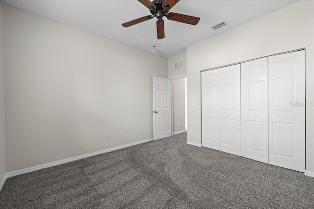 100 Point Pleasant Dr, Palm Coast, FL 32164 - unfurnished bedroom featuring carpet flooring, baseboards, a closet, and a ceiling fan