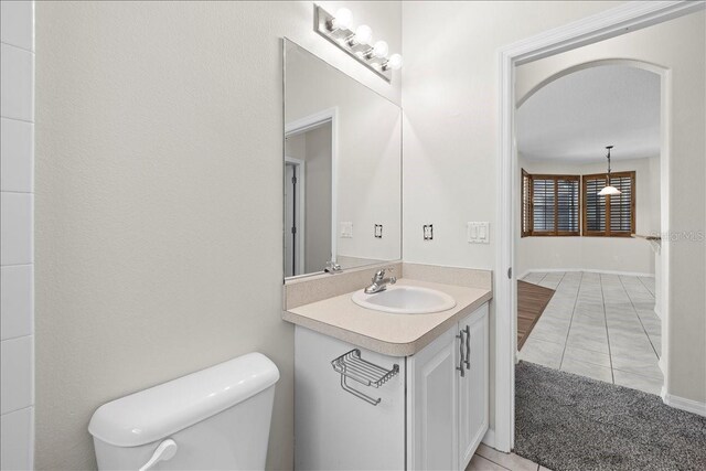 100 Point Pleasant Dr, Palm Coast, FL 32164 - bathroom featuring vanity, toilet, and tile patterned floors