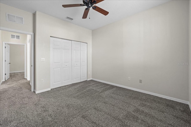 100 Point Pleasant Dr, Palm Coast, FL 32164 - unfurnished bedroom with carpet, baseboards, a closet, and ceiling fan