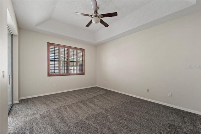 100 Point Pleasant Dr, Palm Coast, FL 32164 - carpeted spare room with a raised ceiling, ceiling fan, baseboards, and a textured ceiling