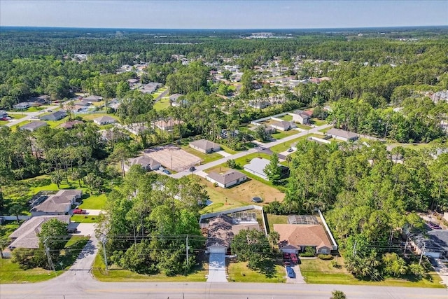 100 Point Pleasant Dr, Palm Coast, FL 32164 - aerial view of property and surrounding area featuring a heavily wooded area and nearby suburban area