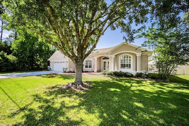 100 Point Pleasant Dr, Palm Coast, FL 32164 - single story home featuring driveway, french doors, stucco siding, and a garage