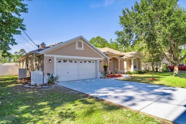 100 Point Pleasant Dr, Palm Coast, FL 32164 - single story home featuring an attached garage, concrete driveway, and stucco siding