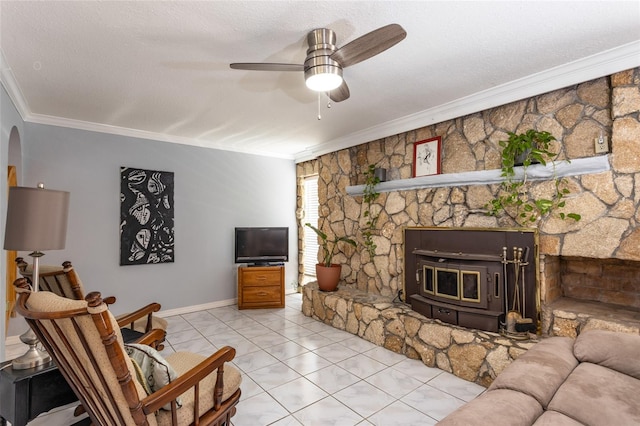 5009 Shore Dr, Saint Augustine, FL 32086 - living room featuring ornamental molding, arched walkways, a ceiling fan, and a wood stove