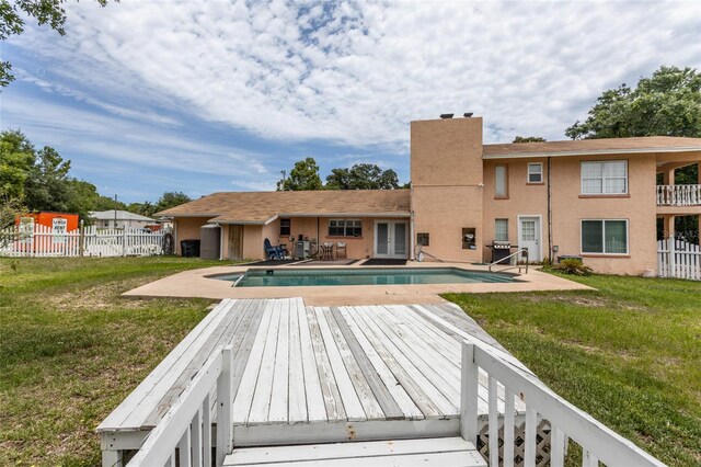 5009 Shore Dr, Saint Augustine, FL 32086 - back of property featuring french doors, a chimney, a patio, and stucco siding