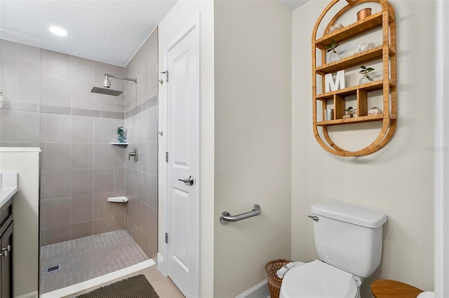 40 Biscayne Dr, Palm Coast, FL 32137 - bathroom featuring tiled shower, toilet, vanity, baseboards, and tile patterned floors
