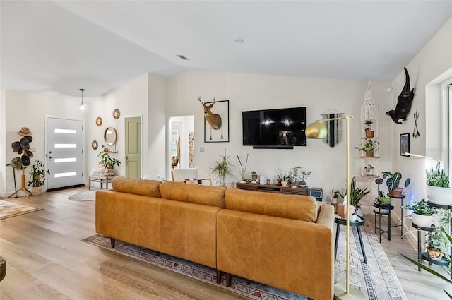 40 Biscayne Dr, Palm Coast, FL 32137 - living area featuring lofted ceiling and light wood-style floors