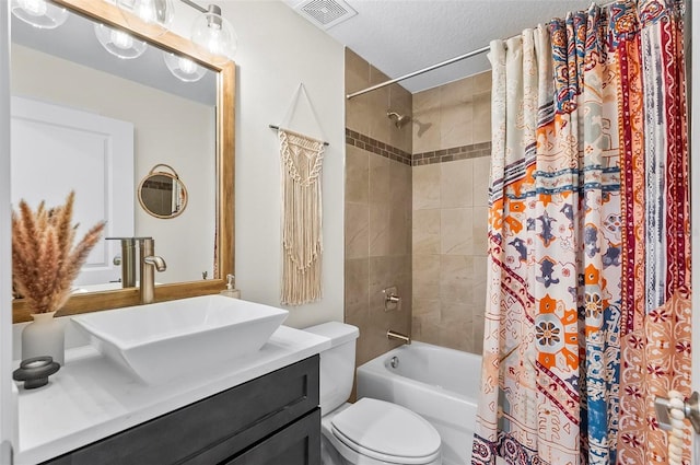 40 Biscayne Dr, Palm Coast, FL 32137 - bathroom featuring vanity, toilet, shower / tub combo, and a textured ceiling