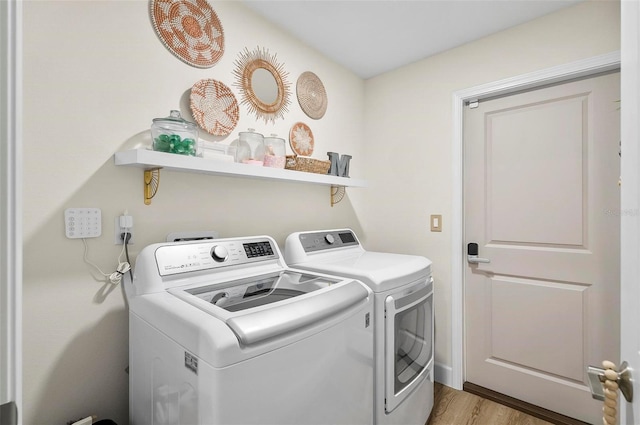 40 Biscayne Dr, Palm Coast, FL 32137 - laundry area featuring washing machine and dryer and light wood-type flooring