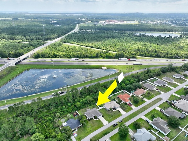 40 Biscayne Dr, Palm Coast, FL 32137 - view of property location with a nearby body of water, a forest, and nearby suburban area