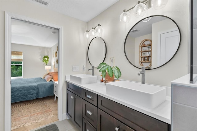 40 Biscayne Dr, Palm Coast, FL 32137 - full bathroom featuring ensuite bath, double vanity, and tile patterned flooring