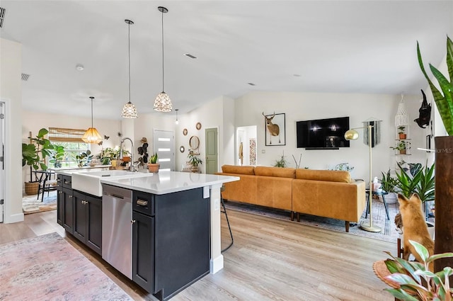 40 Biscayne Dr, Palm Coast, FL 32137 - kitchen with dishwasher, a sink, vaulted ceiling, light countertops, and light wood-style floors