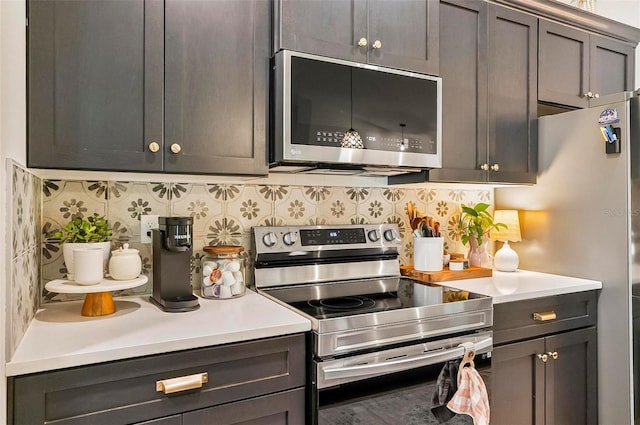 40 Biscayne Dr, Palm Coast, FL 32137 - kitchen featuring stainless steel appliances, decorative backsplash, and light countertops