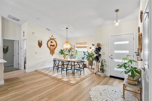 40 Biscayne Dr, Palm Coast, FL 32137 - foyer featuring light wood-type flooring, baseboards, and lofted ceiling