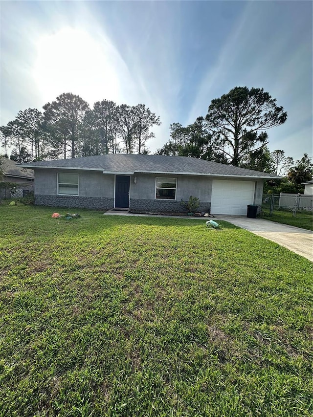 4 Sleepy Hollow Trl, Palm Coast, FL 32164 - view of front of house featuring driveway, an attached garage, and stucco siding