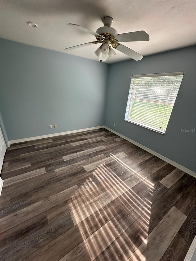 4 Sleepy Hollow Trl, Palm Coast, FL 32164 - empty room with a ceiling fan, baseboards, and dark wood-type flooring