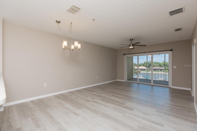 600 Canopy Walk Ln Unit 634, Palm Coast, FL 32137 - empty room with ceiling fan, light wood-style flooring, a chandelier, and baseboards
