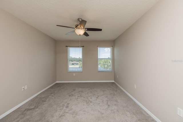 600 Canopy Walk Ln Unit 634, Palm Coast, FL 32137 - carpeted empty room featuring ceiling fan, baseboards, and a textured ceiling