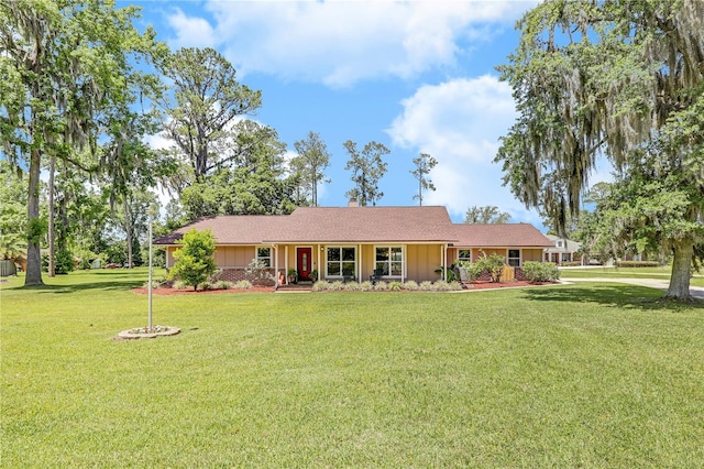 1466 Arena Rd, Fleming Island, FL 32003 - single story home featuring a front lawn and board and batten siding