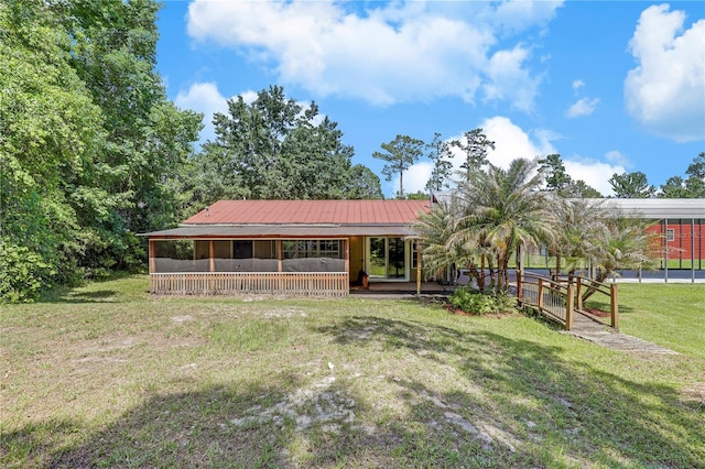 1466 Arena Rd, Fleming Island, FL 32003 - view of front of home with a front yard, a porch, and metal roof
