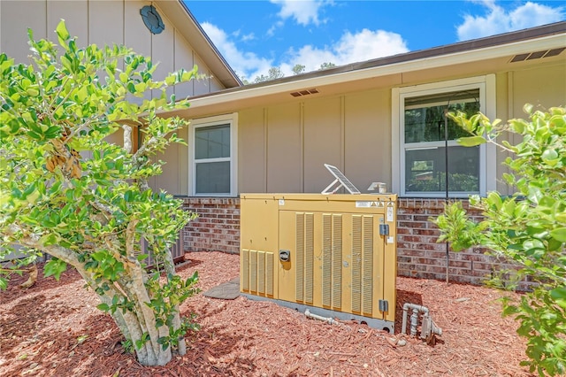 1466 Arena Rd, Fleming Island, FL 32003 - view of property exterior featuring board and batten siding and brick siding