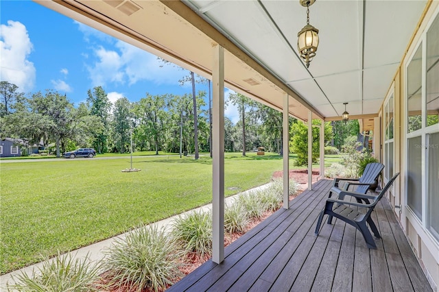 1466 Arena Rd, Fleming Island, FL 32003 - porch featuring a lawn and view of scattered trees