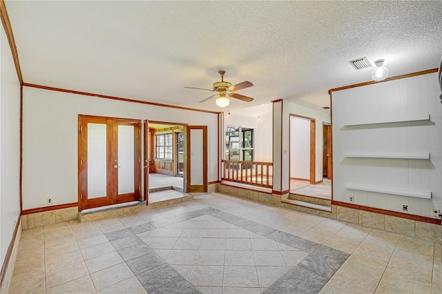 1466 Arena Rd, Fleming Island, FL 32003 - tiled empty room featuring baseboards, french doors, ceiling fan, a textured ceiling, and ornamental molding