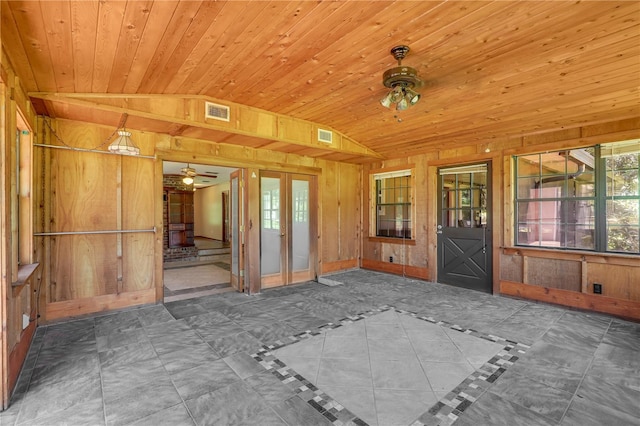 1466 Arena Rd, Fleming Island, FL 32003 - spare room with wood walls, lofted ceiling, a ceiling fan, wood ceiling, and french doors