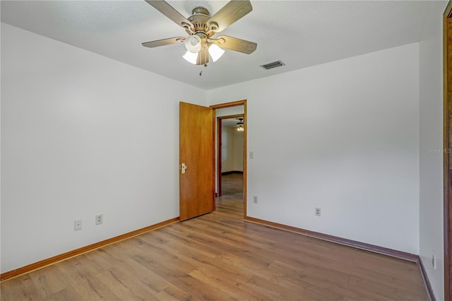 1466 Arena Rd, Fleming Island, FL 32003 - unfurnished room with baseboards, light wood-type flooring, and ceiling fan
